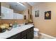 Cozy bathroom with vanity sink, decorative mirrors, and shower at 6529 Hartwood Rd, Las Vegas, NV 89108