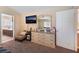 Bedroom with neutral walls, doorway to bathroom, and dresser with mirror at 6529 Hartwood Rd, Las Vegas, NV 89108