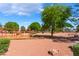 Neighborhood playground with mature trees and equipment for outdoor activities at 6529 Hartwood Rd, Las Vegas, NV 89108