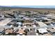Aerial view of desert community featuring homes with desert landscaping and mountain views at 6841 Longmeadow Dr, Pahrump, NV 89061