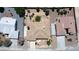 A top-down aerial view of a residence features a desert landscaped yard and neighboring homes at 6841 Longmeadow Dr, Pahrump, NV 89061