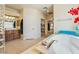 Luxurious bathroom with a deep soaking tub, dual vanity, and decorative glass block window for natural light at 6841 Longmeadow Dr, Pahrump, NV 89061
