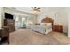 Well-lit bedroom with stylish furnishings, bay windows, and neutral tones creating a serene retreat at 6841 Longmeadow Dr, Pahrump, NV 89061
