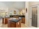 Charming kitchen with wooden cabinets, granite countertops, island, and stainless steel appliances at 6841 Longmeadow Dr, Pahrump, NV 89061