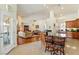Open kitchen floor plan with granite countertop breakfast bar and access to a formal dining area at 6841 Longmeadow Dr, Pahrump, NV 89061