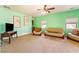 Spacious living room with comfortable couches, carpet and a ceiling fan at 6841 Longmeadow Dr, Pahrump, NV 89061