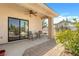 Relaxing covered patio with brick pavers and comfortable seating area at 6841 Longmeadow Dr, Pahrump, NV 89061