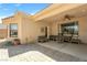 Covered patio area with brick and concrete flooring, outdoor seating, and a ceiling fan at 6841 Longmeadow Dr, Pahrump, NV 89061