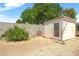Backyard featuring a shed in a desert landscaped yard with block wall and desert foliage at 6841 Longmeadow Dr, Pahrump, NV 89061