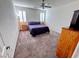 Comfortable bedroom with carpet, shutters and neutral colors offering an airy, relaxing feel at 7035 Thistle Ridge St, Las Vegas, NV 89166