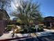 Landscaped common area with walkways, mature trees, and well-maintained shrubbery at 7035 Thistle Ridge St, Las Vegas, NV 89166