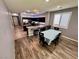 Open floor plan with eat in kitchen features a kitchen island with bar seating and modern decor at 7035 Thistle Ridge St, Las Vegas, NV 89166