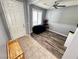 Flex space at front of house with wood floors, arcade game and access to front door at 7035 Thistle Ridge St, Las Vegas, NV 89166