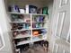 Well-organized pantry with ample shelving for food storage and household items, maximizing kitchen efficiency at 7035 Thistle Ridge St, Las Vegas, NV 89166