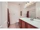 Well-lit bathroom featuring a vanity with storage and a large mirror, perfect for daily routines at 7465 Widewing Dr, North Las Vegas, NV 89084