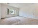 Spacious bedroom with a large window overlooking a lush yard providing natural light at 7465 Widewing Dr, North Las Vegas, NV 89084