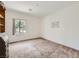 Inviting bedroom with a large window offering views of the outdoors, creating a relaxing atmosphere at 7465 Widewing Dr, North Las Vegas, NV 89084