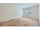 Bright and spacious bedroom with carpet floors and large windows, providing ample natural light at 7465 Widewing Dr, North Las Vegas, NV 89084