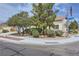 Landscaped corner lot showcases a well-maintained single-story home with mature trees at 7465 Widewing Dr, North Las Vegas, NV 89084