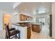 Spacious kitchen featuring modern appliances, granite countertops, and a center island with breakfast bar at 7465 Widewing Dr, North Las Vegas, NV 89084