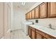 Functional laundry room with washer, dryer, and cabinets, making laundry tasks efficient at 7465 Widewing Dr, North Las Vegas, NV 89084