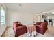 Comfortable living room featuring ample seating and a view into the breakfast bar, ideal for relaxation and socializing at 7465 Widewing Dr, North Las Vegas, NV 89084