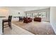 Open-concept living area with a dining space, flooded with light from large windows, perfect for entertaining at 7465 Widewing Dr, North Las Vegas, NV 89084
