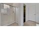 Bathroom boasts walk-in shower with glass door, and a closet with ample storage space at 7606 Grove Acre Ct, Las Vegas, NV 89131