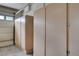 Garage features plenty of storage cabinets and a window to allow more natural light into the space at 7606 Grove Acre Ct, Las Vegas, NV 89131