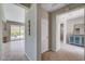 Hallway leading to living areas showcasing tile flooring and neutral color palette at 7606 Grove Acre Ct, Las Vegas, NV 89131