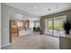 Open kitchen with tile floors, granite countertops, stainless steel appliances and access to the patio at 7606 Grove Acre Ct, Las Vegas, NV 89131