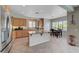 This kitchen features a large island, granite countertops, and light wood cabinetry at 7606 Grove Acre Ct, Las Vegas, NV 89131