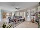 Open-concept living room seamlessly connects to the kitchen, creating an inviting space for entertaining at 7606 Grove Acre Ct, Las Vegas, NV 89131