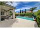 Backyard pool surrounded by lush landscaping creating a backyard paradise at 7606 Grove Acre Ct, Las Vegas, NV 89131