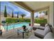 Backyard pool with mature landscaping creates a private and relaxing oasis at 7606 Grove Acre Ct, Las Vegas, NV 89131