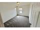 Bedroom featuring plush carpet, bright windows, and neutral walls at 7815 Shingle Beach St, Las Vegas, NV 89166