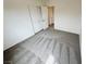 Bedroom showcasing plush carpet and a closet with double doors at 7815 Shingle Beach St, Las Vegas, NV 89166