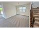 Dining room featuring neutral walls, carpet, natural light, and stair access at 7815 Shingle Beach St, Las Vegas, NV 89166