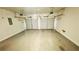 Spacious garage with dual automatic doors and ample space for vehicles and storage at 7815 Shingle Beach St, Las Vegas, NV 89166