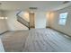 Open living space showcasing carpet, neutral walls, and access to other areas of the home at 7815 Shingle Beach St, Las Vegas, NV 89166