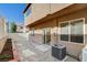 Enclosed backyard featuring white fence, gray rock and sliding glass door at 7963 Cape Brett St, Las Vegas, NV 89131