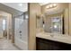Bathroom featuring a vanity with dark cabinets and a shower-tub combo at 7963 Cape Brett St, Las Vegas, NV 89131