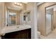 Bathroom featuring vanity with dark cabinets and a white shower-tub combo at 7963 Cape Brett St, Las Vegas, NV 89131