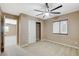 Bedroom featuring neutral walls, carpeting, closet with bi-fold doors, and natural light at 7963 Cape Brett St, Las Vegas, NV 89131