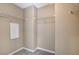 Walk-in closet with shelving, neutral walls and carpeting at 7963 Cape Brett St, Las Vegas, NV 89131