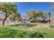 Community park with lush green grass, picnic table, and mature trees at 7963 Cape Brett St, Las Vegas, NV 89131