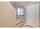 The entryway features a stairway, neutral paint, and a white front door at 7963 Cape Brett St, Las Vegas, NV 89131