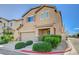 Attractive two-story home offers a two-car garage and well-maintained front yard with lush bushes at 7963 Cape Brett St, Las Vegas, NV 89131