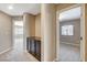 Hallway featuring neutral walls, carpeting, and a built-in dark cabinet at 7963 Cape Brett St, Las Vegas, NV 89131
