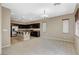 Open concept living space seamlessly blends the living room with the well-appointed kitchen, featuring an island at 7963 Cape Brett St, Las Vegas, NV 89131